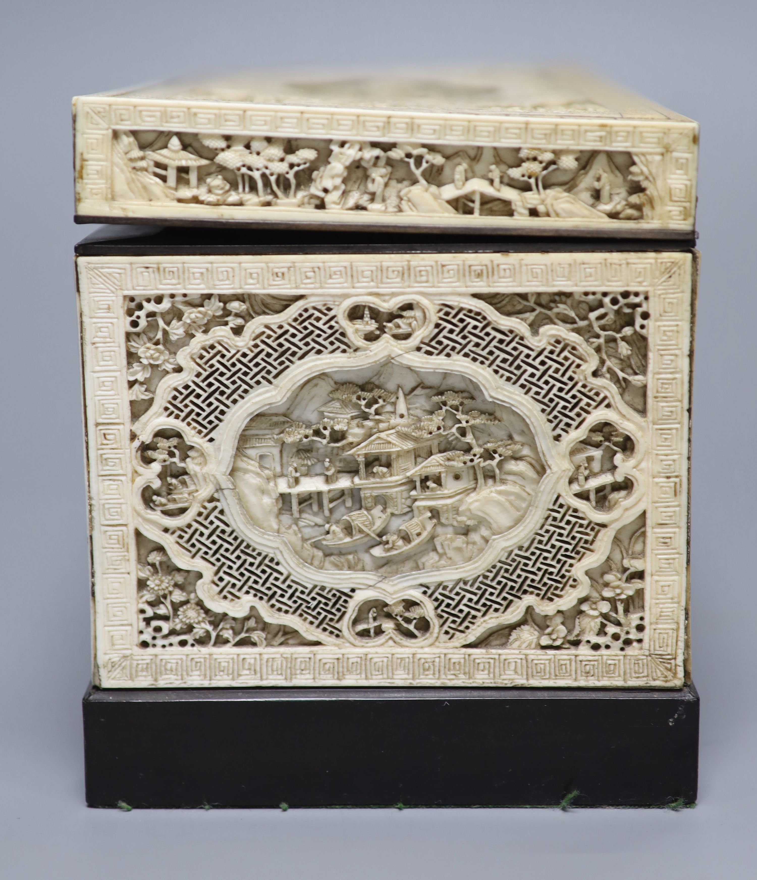 A good pair of George II embossed silver tea caddies and covers, by Elizabeth Godfrey, London, 1749/50, housed in a later 19th century pierced Canton ivory mounted caddy, with velvet interior